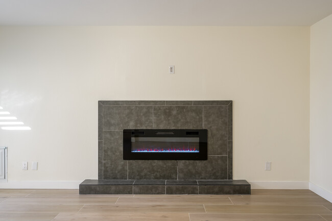 Family Room with Electric Fireplace - 8569 E Garfield St