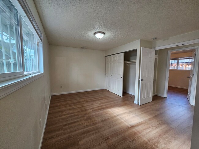 Building Photo - Charming Single-Level Home Featuring New Hardwood Floors, Bright Bedrooms & Open-Concept Living