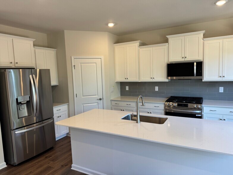 Kitchen with new Fridge - 1203 Mary Jane Ave