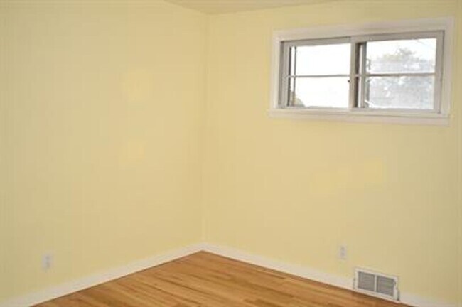 Building Photo - Updated house with original hardwoods and 2-car garage!