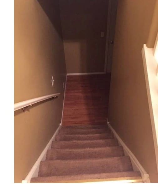 Stairs down to 3rd bedroom - 18892 S Vanderbilt Dr