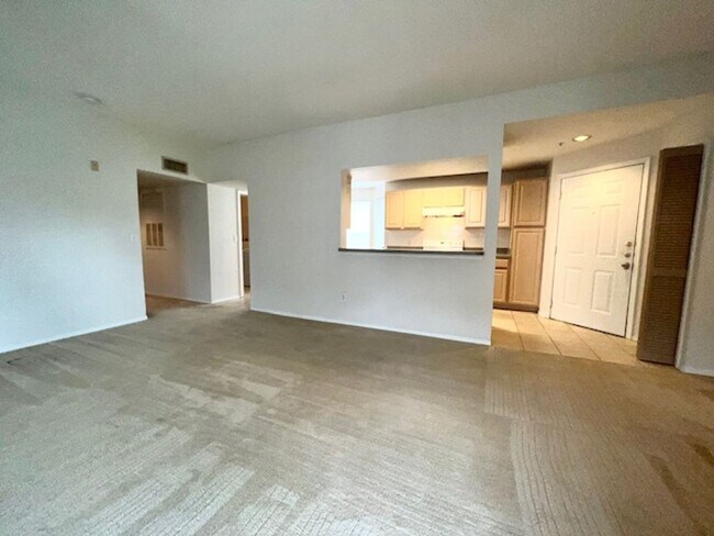 Building Photo - Move in NOW- Spacious 2 bedroom 1 bath condo on 3rd floor in gated community! Water included with...