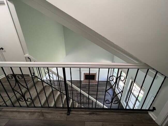 View of living room from upstairs hallway - 14103 W 88th Terrace