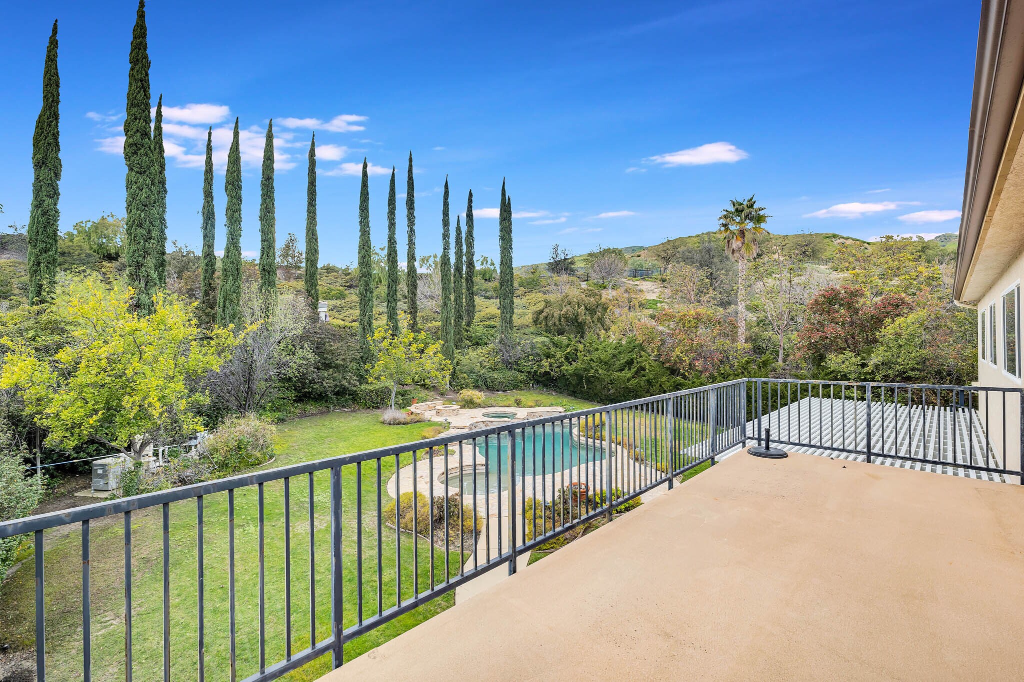 Primary Suite Balcony Overlooking The Back Yard - 12215 Delante Ct