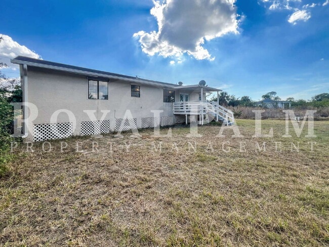 Building Photo - 4 Bedrooms, 2 Bathrooms & a Huge Backyard — Spacious Lehigh Acres Home with Pet-Friendly Living o...