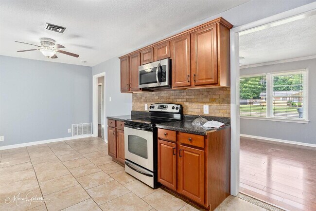 Building Photo - "Charming 3-Bed Oasis with 2 Baths on Joy ...
