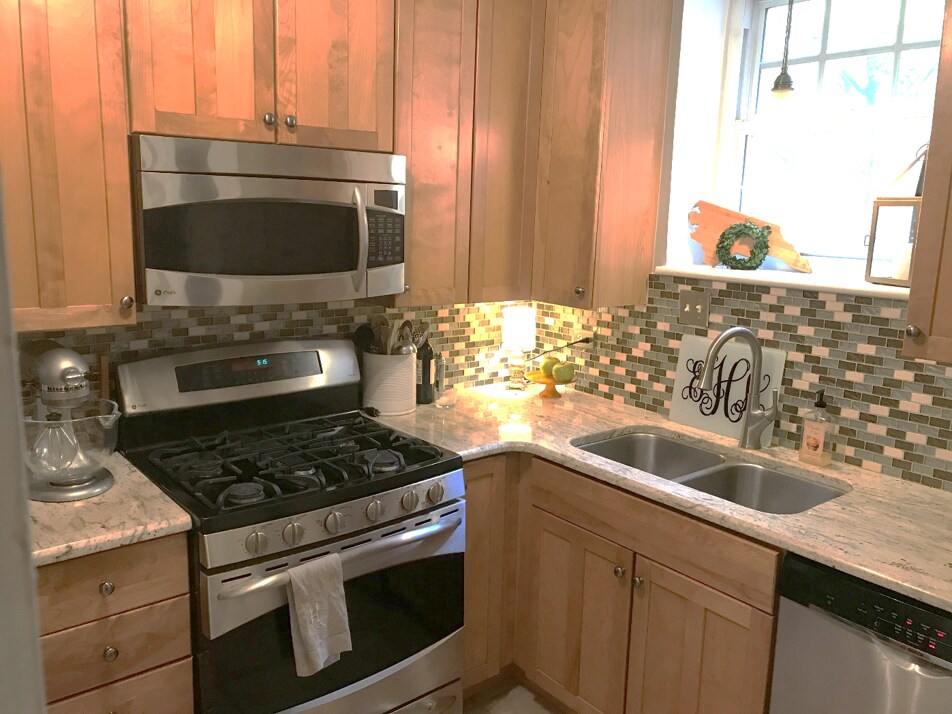Kitchen with window has gas stove and range with double oven, dishwasher and heavy duty 1/2 HP garbage disposal. - 1337 E. Morehead Street