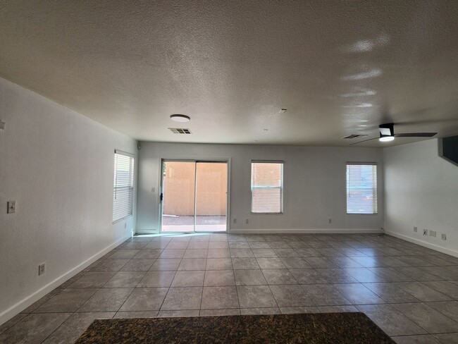 Building Photo - Sleek 2 story home with tile in most living areas and upgraded kitchen.