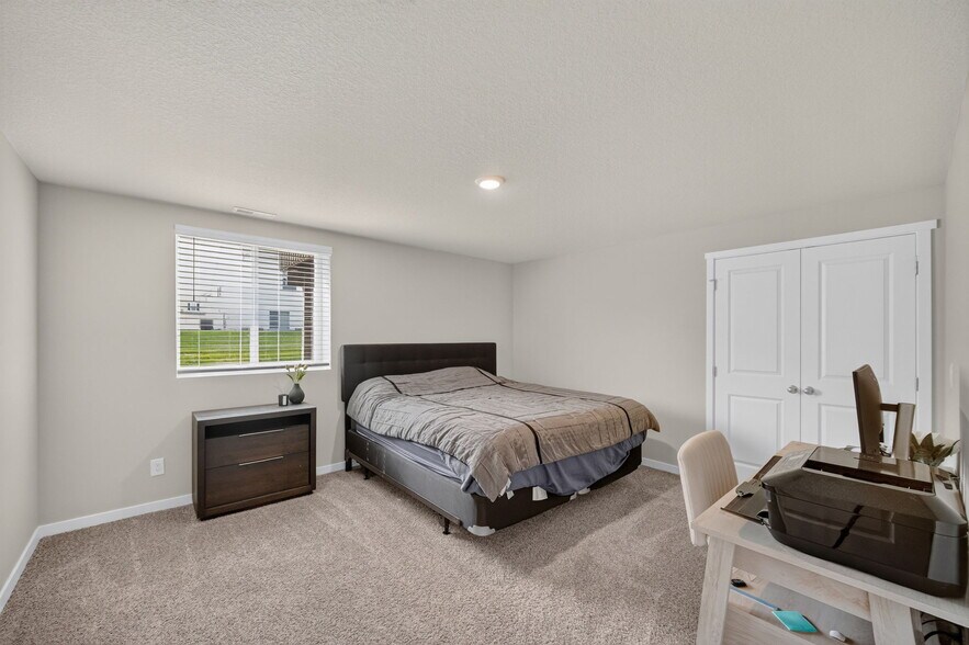 very large bedroom 4 lower level with large closet the whole length of the room - 1080 Bel Aire Ct