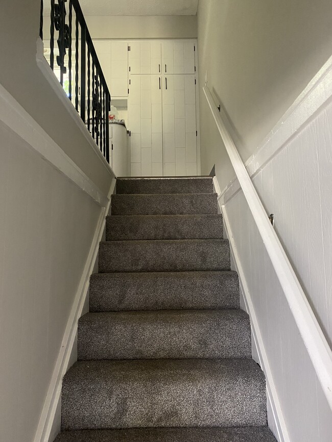 Stairs from basement leading to kitchen - 4472 King Arthur Dr