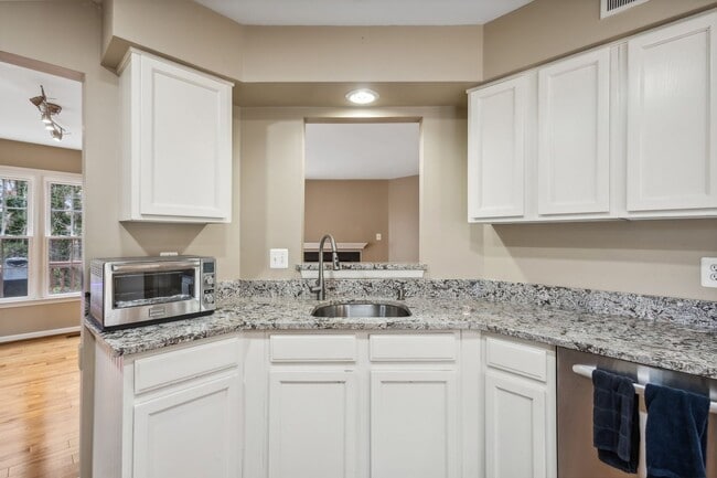 Building Photo - Modern Brick End-Unit Townhome with Stunning Upgrades and Serene Wooded Views