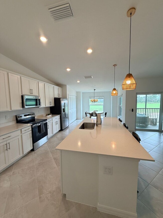 Building Photo - Beautifully Furnished Second-Floor Coach Home in the New Webb’s Reserve Golf & Country Club – Gol...