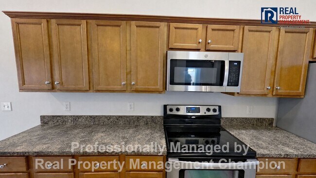 Building Photo - 3BD/2BA home w/vaulted ceilings, fireplace, 2-car garage, deck and fenced backyard