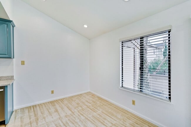 Building Photo - Spacious condo available in desirable Newpark Village community!