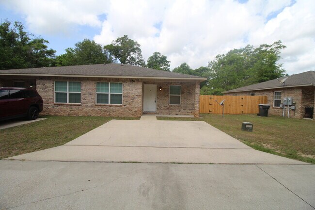 Building Photo - West Pensacola Duplex Living — 3BR Home with Open Floor Plan, Eat-In Kitchen, Covered Patio & Low...