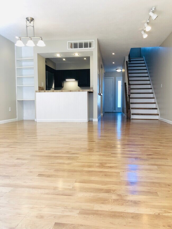 Family room into kitchen - 2550 W Village Dr
