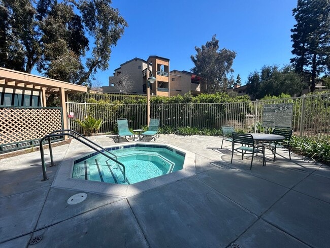Building Photo - One Bedroom with Garage and IN-Unit laundry in Resort-Style Complex