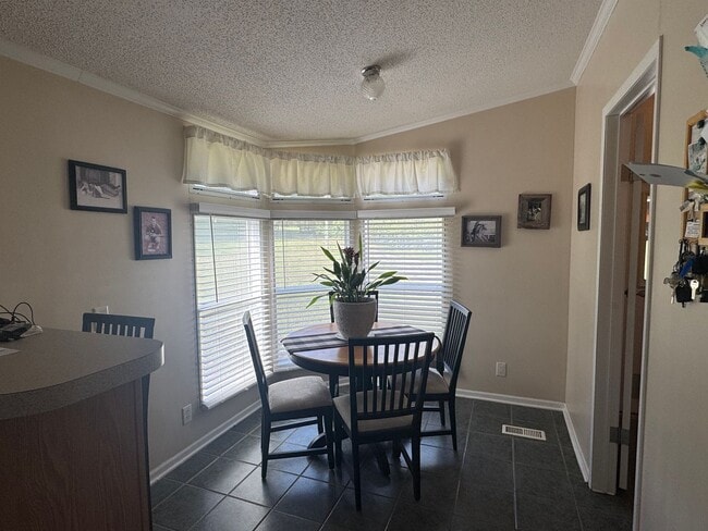 Building Photo - Spacious 3-Bedroom Home with Fenced Lot an...