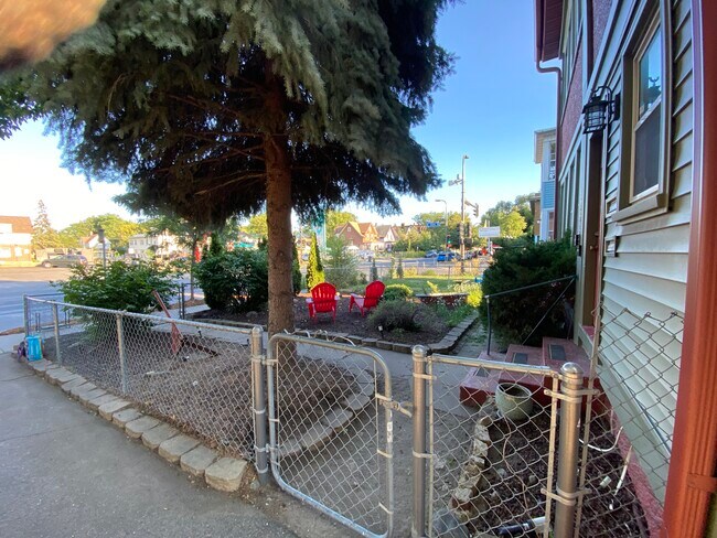 Fenced front yard is a shady late afternoon spot - 3452 Nicollet Ave