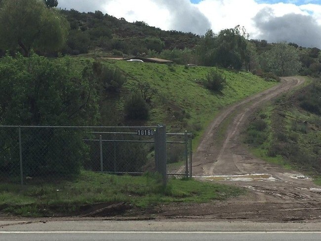 Gate and driveway after rain - 10160 Escondido Canyon Rd