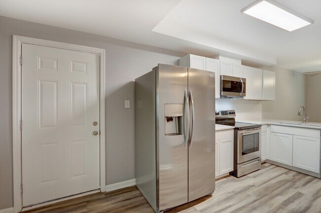 Building Photo - New Construction - Three Bedroom, Three Bathroom Home with yard & parking!