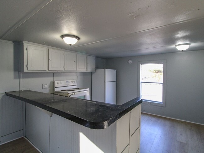 Building Photo - Discover comfortable country living in this nicely updated trailer located just minutes from Faye...