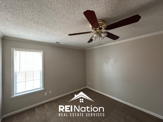 Building Photo - Spacious 4BR/2BA Near Southwind | High Ceilings, Brick Fireplace & 2-Car Garage