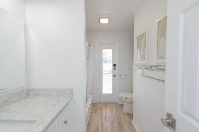 Building Photo - Live the ultimate Space Coast waterfront lifestyle at this stunning beachside canal home in Satel...