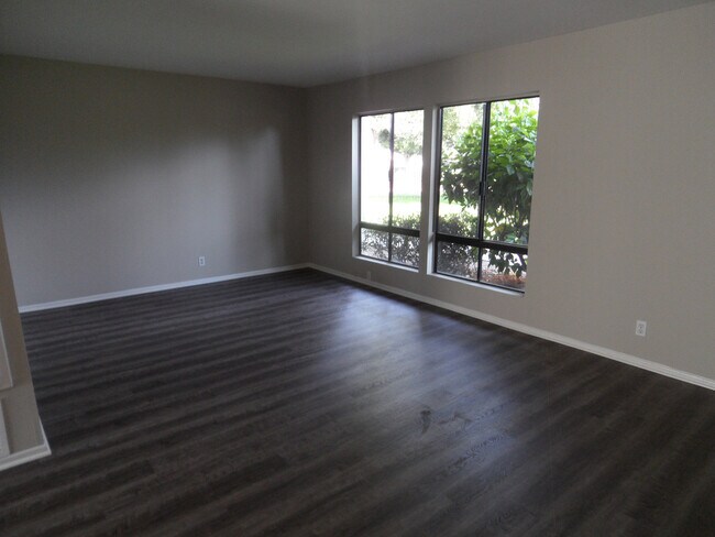 Building Photo - Two Story 4 BR 2.5 BA Condo With 2 Car Garage