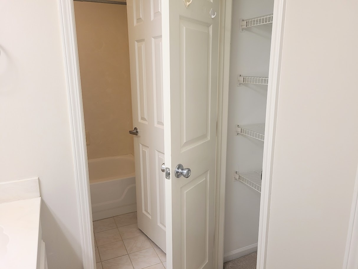 Master Bath linen closet for additional storage - 12439 Coursey Blvd