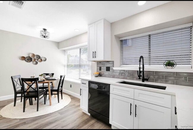 Building Photo - "Charming 4-Bedroom Home with Elegant Gran...