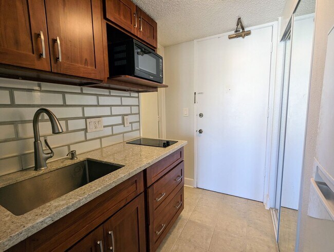 Building Photo - Partially Furnished  Studio with 1-Bath at...