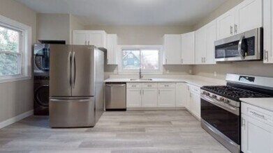 Building Photo - Renovated 6BR with In-Unit Laundry, 3 Parking Spaces & Commuter Rail Access