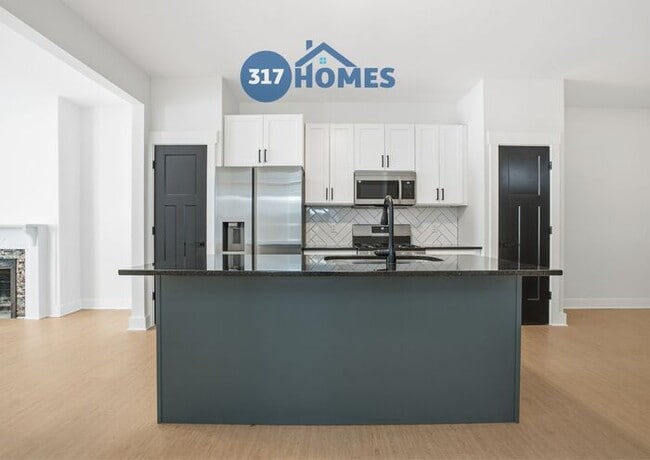 Building Photo - Spacious Four Bedroom Townhome with Main Level Suite in Holy Cross