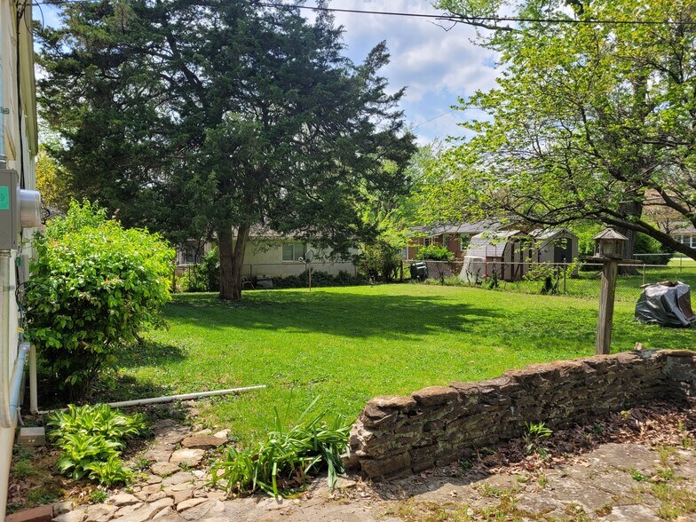 backyard - looking left from back of carport - 8011 Greenway Dr