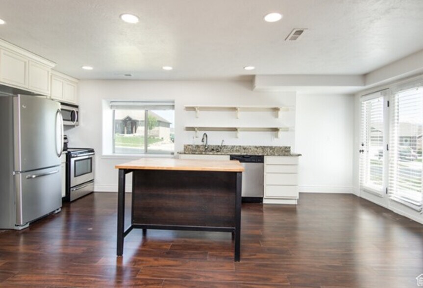 Full kitchen and you walk straight out to the front to the private parking. - 1232 S Regal View Dr