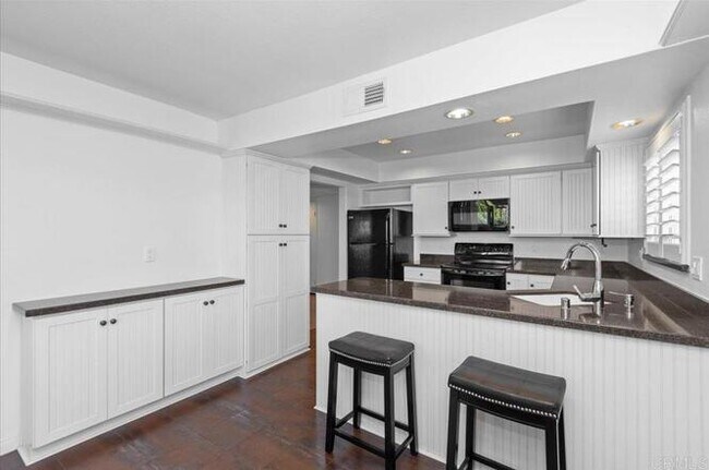 Building Photo - Poolside Living at Its Finest – Turnkey 3BR Condo with Direct Patio Access to the Pool