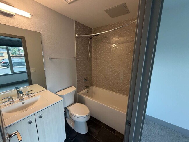 Building Photo - ~Available Now~ Modern 2-Bed Townhouse with Scenic Views near City Park - built in EV charger!