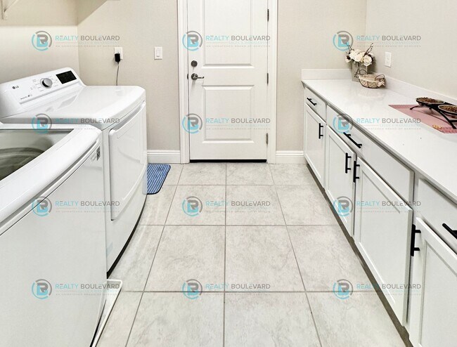 Building Photo - Welcome to your dream home, where modern elegance meets unparalleled convenience!