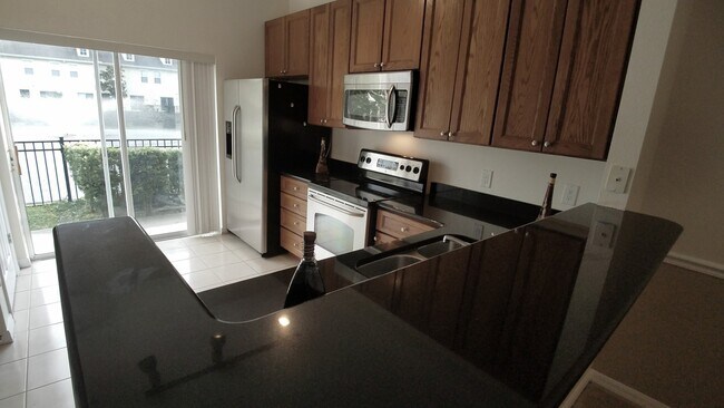 Building Photo - Beautiful Furnished 2/2.5  Pool View Condo x Rent Close to Universities.