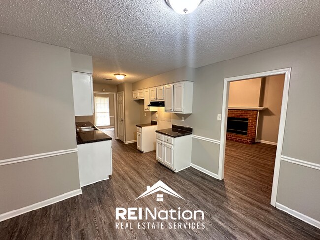 Building Photo - CORDOVA COVE CHARMER! 3BR/2BA | High Ceilings & Brick Fireplace | 2-Car Garage!