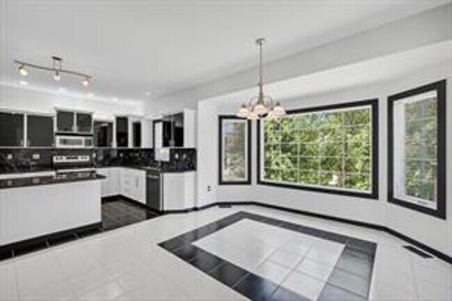 Building Photo - Spacious 5-Bed Walkout Home with Over 3,50...