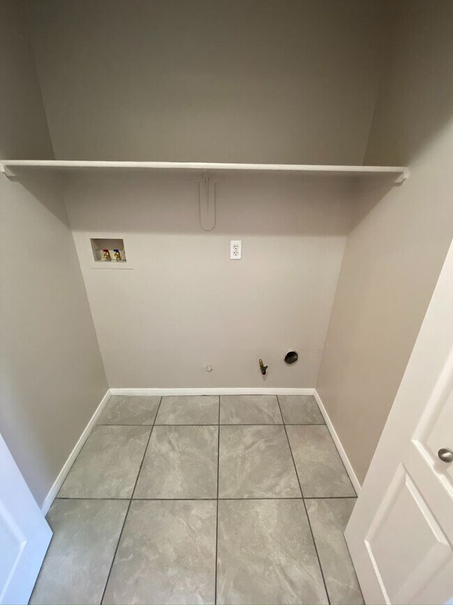 Building Photo - BEAUTIFUL CONDO IN A GATED COMMUNITY FEATURING PLANTATION SHUTTERS, TILE FLOORING AND NEW PAINT T...