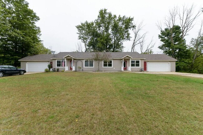 Building Photo - Spacious 3BR Duplex with Finished Basement & 2-Car Garage in Otsego