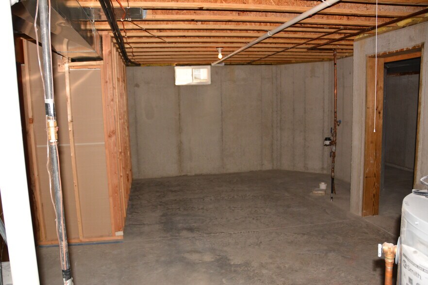 Lots of storage with washer and dryer hookups and water softener. - 325 Cordy Lane