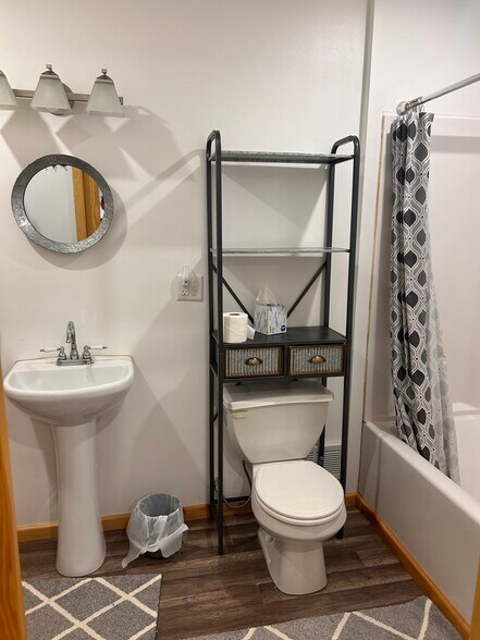 Main floor bathroom with washer and dryer. - 12275 62nd St NE