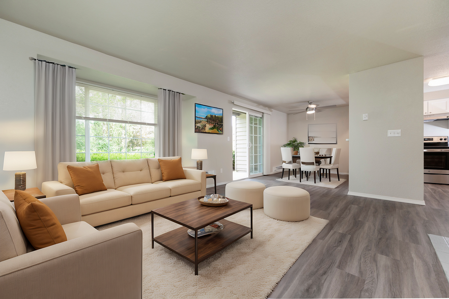 Experience the comfort of this charming living space, perfect for relaxation and entertaining. - Sunset Gardens Apartments