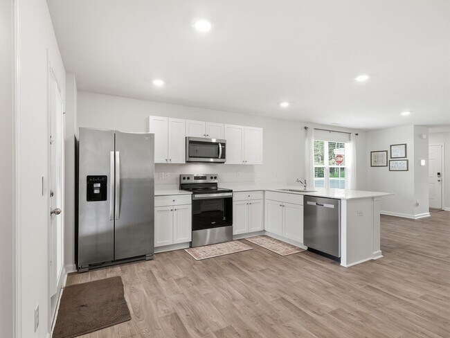 Building Photo - Newly Built 3BD, 2.5BA End Unit Raleigh Townhome with a Fenced Yard in a Prime Location