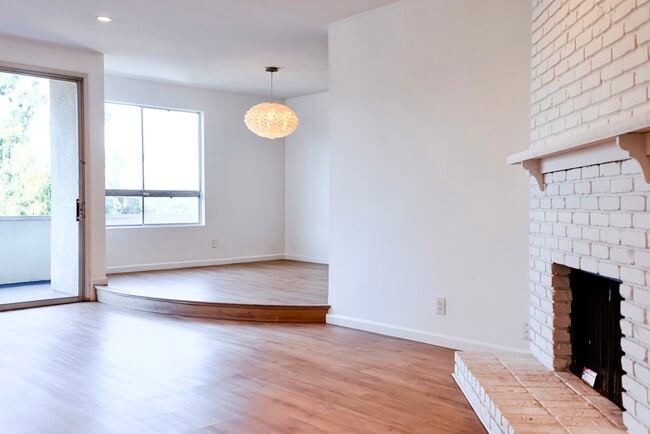 fireplace and dining room - 10650 Holman Ave