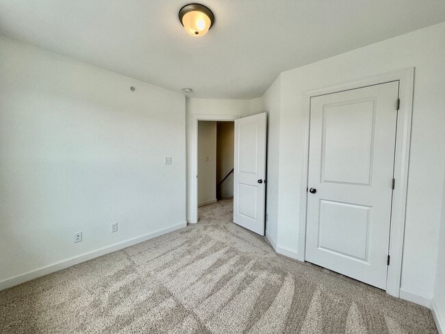 Building Photo - Practically New & Available NOW! Americana Luxury Townhomes! Pet Friendly! Attached Garage! All A...